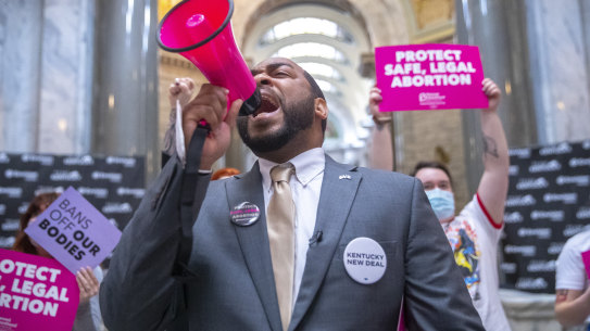Charles Booker, a candidate for US Senate, joins protesters at the Kentucky state Capitol in Frankfort, Kentucky. 
