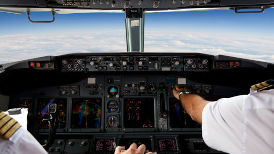 Pilots Working in an Aeroplane During a Commercial Flight. Generic cockpit
