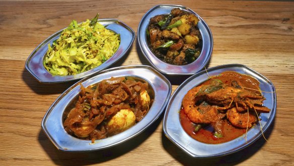 Dishes of egg, cabbage, prawns with okra, and dry pork at Toddy Shop.