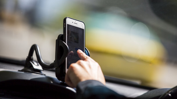 There are perfectly legal reasons to use phones while driving, as long as they are in cradles.