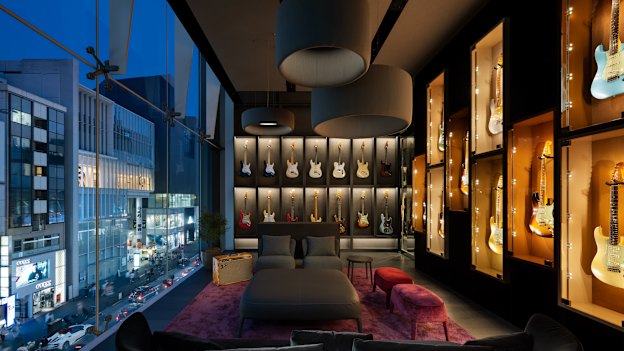 A gallery-style guitar display at Fender Flagship Tokyo.