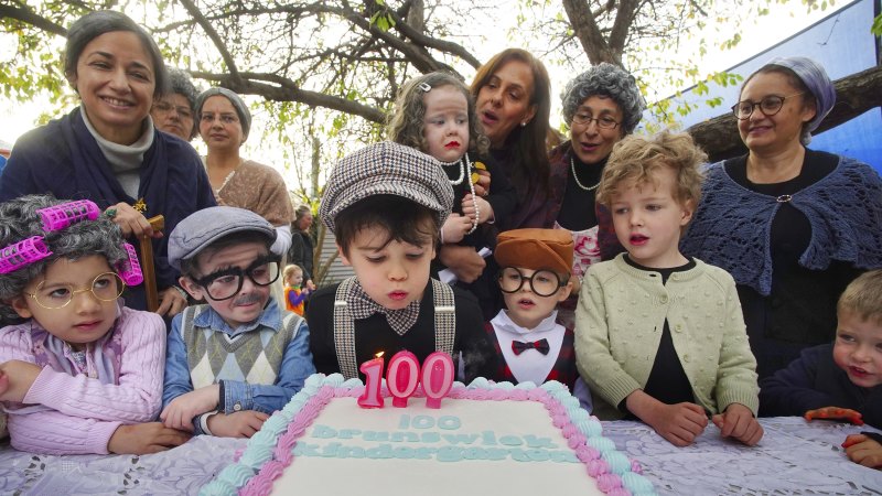 Three cheers as a hardy kindergarten reaches three figures with cake, song and costumes