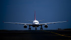 A Qantas airplane lands at Sydney Airport on Tuesday. The airline outperformed Virgin in 2024.