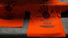 Orange shirts made in honour of the 215 residential school children whose remains were discovered in Kamloops in May.
