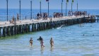 Beachgoers in Frankston soak up the weekend’s hot conditions.