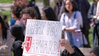 Students, faculty and members of the Harvard community rally against Donald Trump’s moves in April.