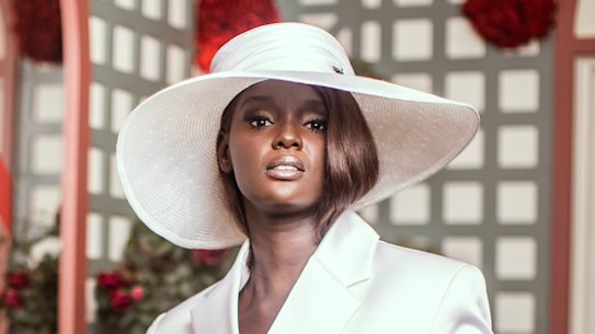 Supermodel Duckie Thot in the Mumm marquee wearing a Michael Lo Sordo suit for Derby Day.