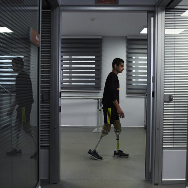 'I am ashamed': Abdalrahman tries out his new legs.