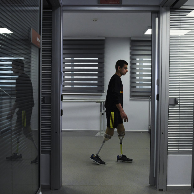 'I am ashamed': Abdalrahman tries out his new legs.