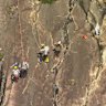 Search and rescue crews retrieved a pair of 18-year-old hikers who fell down a cliff face on Mount Beerwah on Sunday.