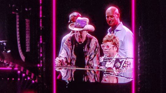 Molly Meldrum joins Elton John on stage at AAMI Park, Melbourne on January 13, 2023.