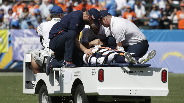 Scary moment: Denver Broncos cornerback DeVante Bausby is taken off the field after being hurt during the first half of the game against the Los Angeles Chargers.