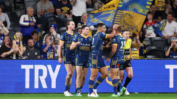 Clint Gutherson celebrates one of his three tries with Eels teammates.