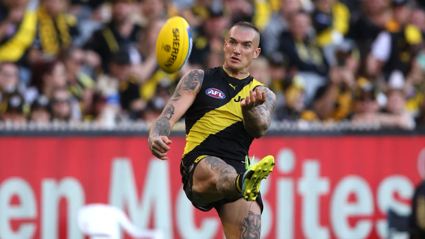 Check side: Dustin Martin fires off a shot for Richmond.