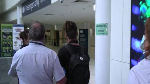The man was taken to Brisbane Airport's international terminal by Border Force officers on Tuesday.