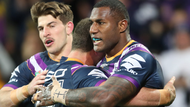 Suliasi Vunivalu (right) after scoring a try during the Storm's qualifying final against the Rabbitohs last week.