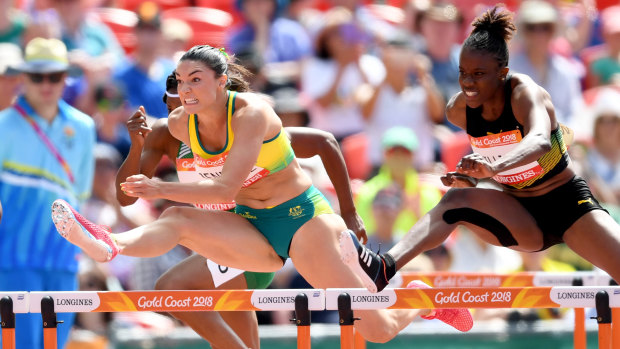 Australia's Michelle Jenneke (left) in the heats of the 100m hurdles.