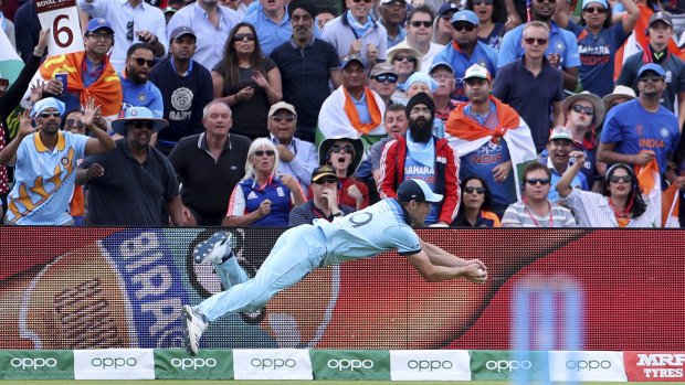 England's Chris Woakes takes a catch against India. 
