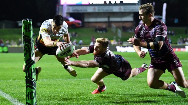 Charlie Staines flies high to cross for a try in the corner against Manly.