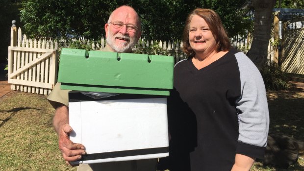 Bob Luttrell removes Kerry-Anne Cameron's water meter box, which was filled with native stingless bees.