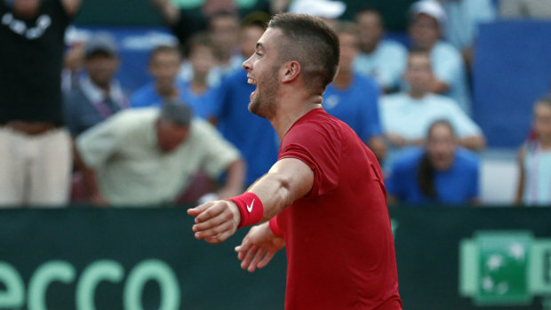 Triumph: Croatia's Borna Coric reacts after defeating Frances Tiafoe in their Davis Cup semi-final singles match.