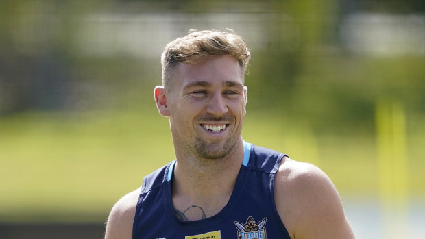 Gold Coast Titans player Bryce Cartwright is waiting to learn if he will be cleared to train despite his anti-vaccination stance. 