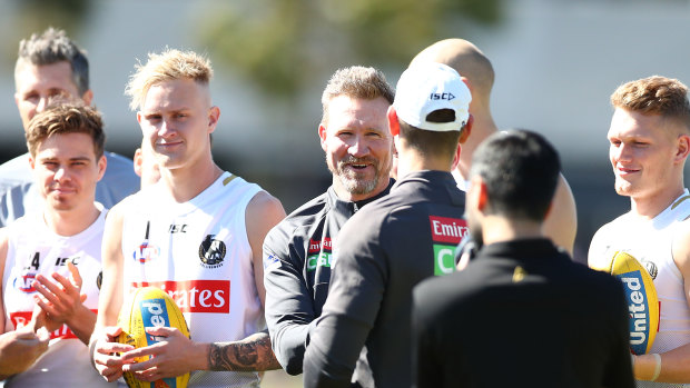 Collingwood coach Nathan Buckley and his men at Thursday's training session.