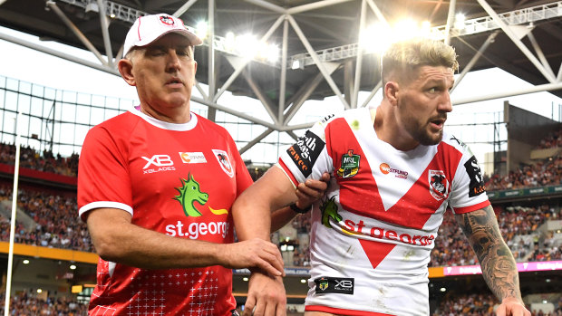 Major loss: Gareth Widdop is walked off the field after again dislocating his shoulder.