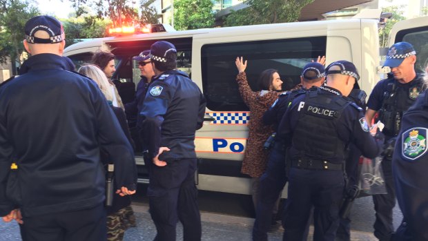 Police make their second round of arrests, directly opposite Brisbane Magistrates Court.