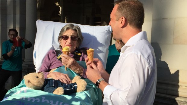 Health Minister Steven Miles eating passionfruit gelato with Betty.