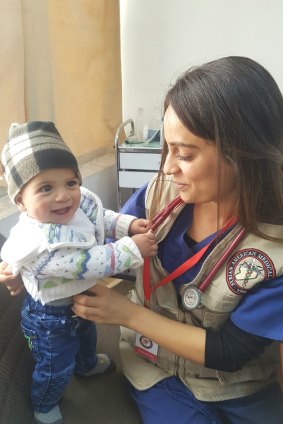 Dr Kashan Baba examines a Syrian child in the Zaatari refugee camp in November 2017.