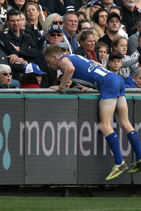 The moment in question: Jack Ziebell runs into the signage.