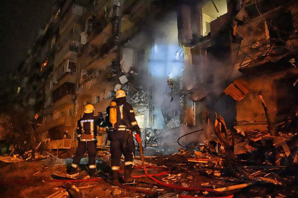 High-rise towers burned in the night in Kyiv after the city was hit with heavy shelling. 