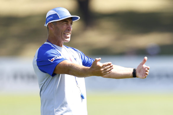 Tear down that wall: Alastair Clarkson at North Melbourne training on Monday.