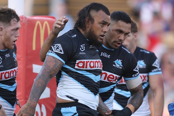The Sharks celebrate Addin Fonua-Blake’s try against Newcastle.