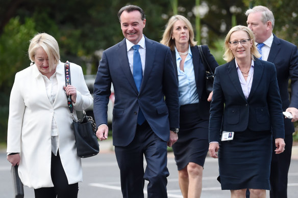 Michael O’Brien arrives at state parliament on Tuesday morning flanked by allies.