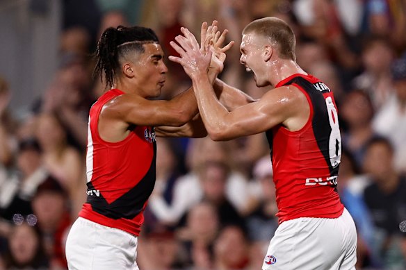 Isaac Kako (left) and Ben Hobbs of the Bombers celebrate a goal.
