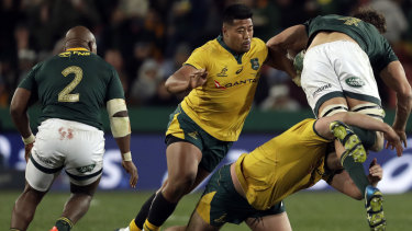 Take out the legs: James Slipper tackles a flying Eben Etzebeth.