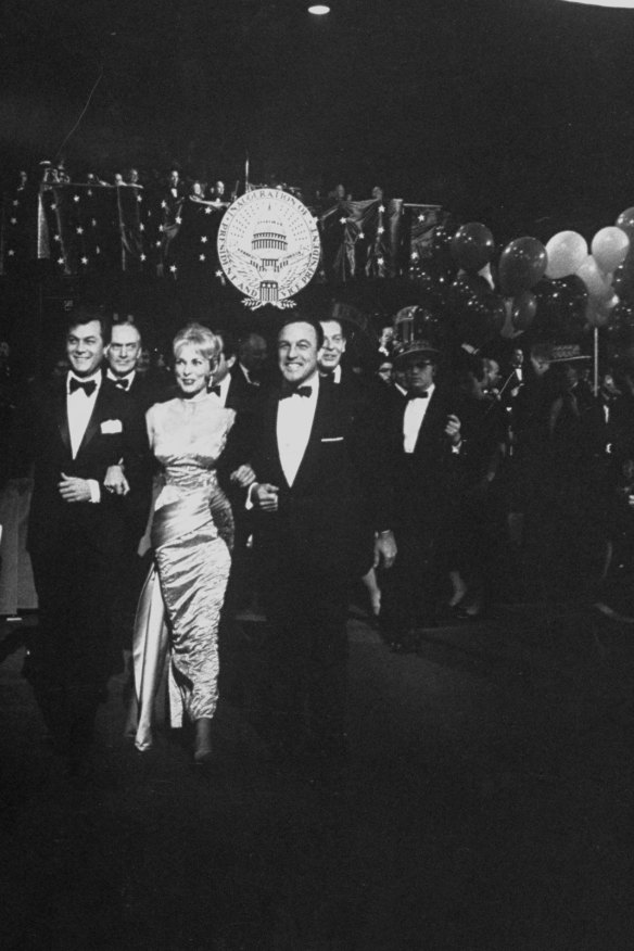 Actors Tony Curtis, Janet Leigh and Gene Kelly at John F Kennedy's inaugural ball in 1961. 