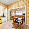 The bright yellow kitchen at 70 Cooper Street