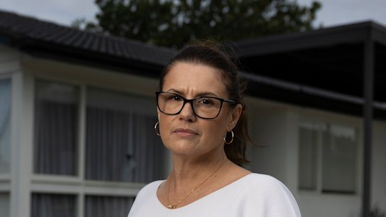 Lisa Woodall pictured in front of her late parents’ house.