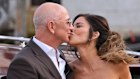 Jeff Bezos and Lauren Sanchez kiss as they leave a hotel for their pre wedding reception, in Venice.