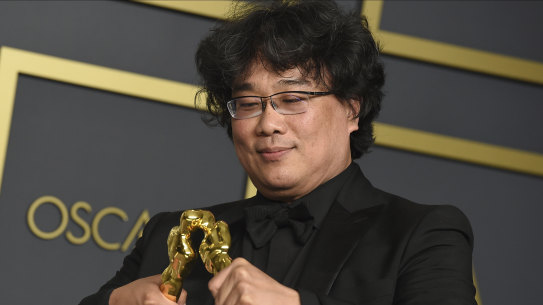 Bong Joon-Ho with the awards for best director and best international feature film for Parasite at the Oscars.