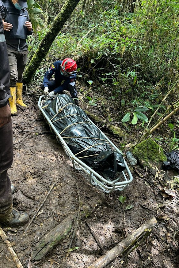 Ecuadorian soldiers and firefighters retrieve a dead body from the illegal mines in La Merced de Buenos Aires in June 2026.