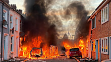 Vehicles set on fire by protesters burn on Lendrick Street in east Belfast, Northern Ireland.