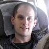 Wall Street Journal reporter Evan Gershkovich inside an airplane outside Moscow, waiting to go home.