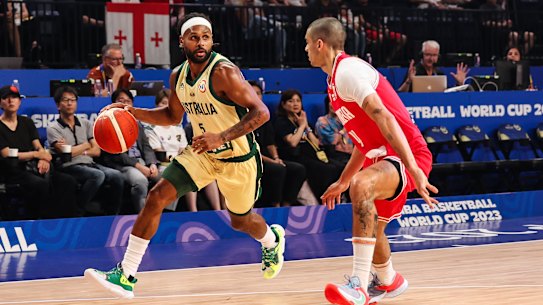 Patty Mills drives to the basket against Georgia.