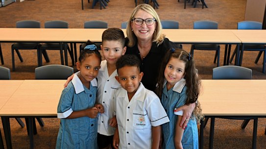 St Marianne Cope Catholic School principal Jackie Byrne with students Madisen, left, Mason, Matyas, and Eva at the schoool in Truganina.