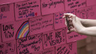 Messages of hope fill a board at a Pink Dot event in Singapore in 2019.