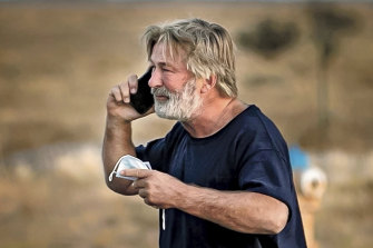 Alec Baldwin speaks on the phone outside the Santa Fe County Sheriff’s Office after he voluntarily gave a statement to police. 